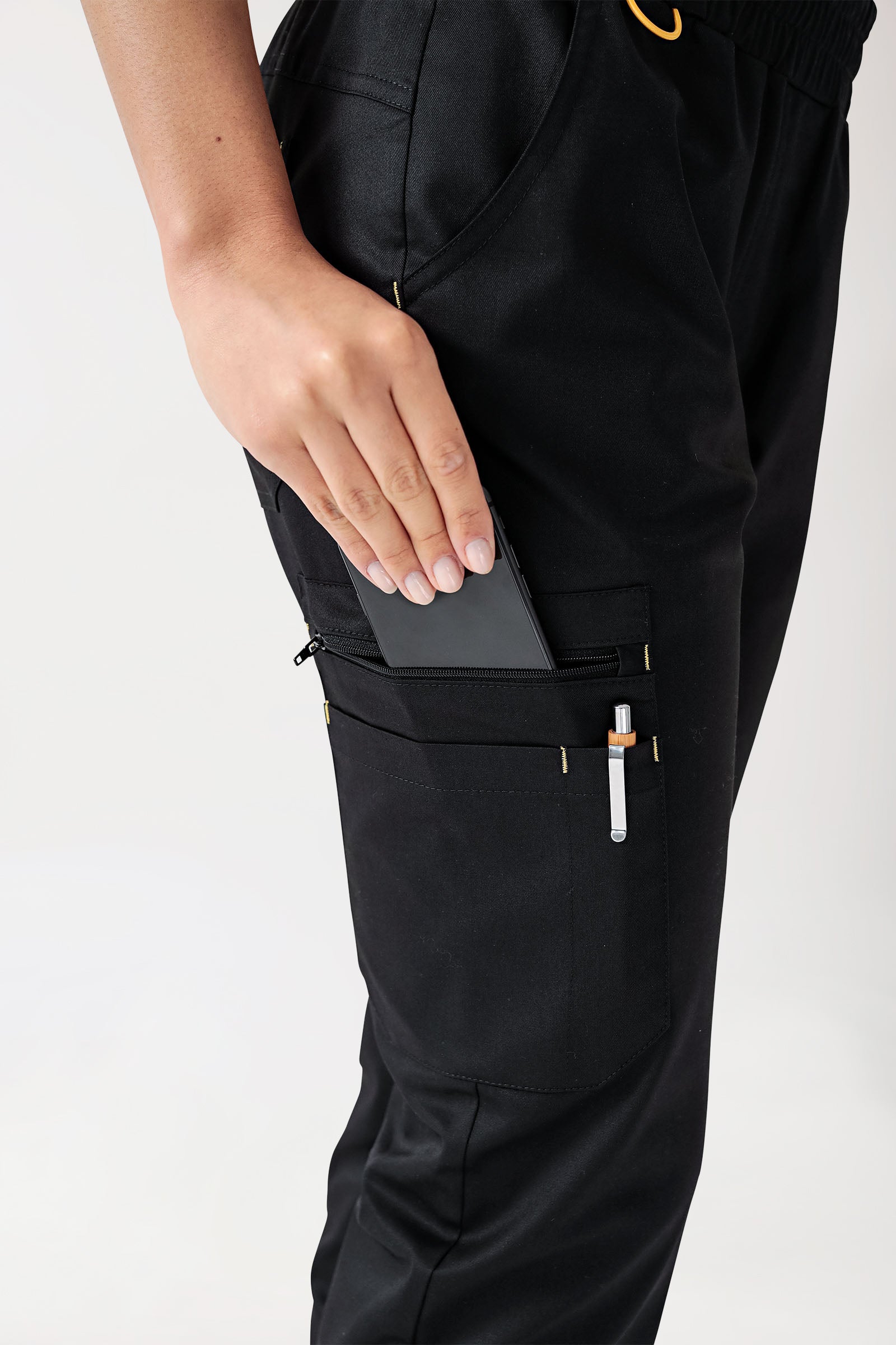 CLINIC STRETCH Pantalon Femme - Taille courte noir/jaune