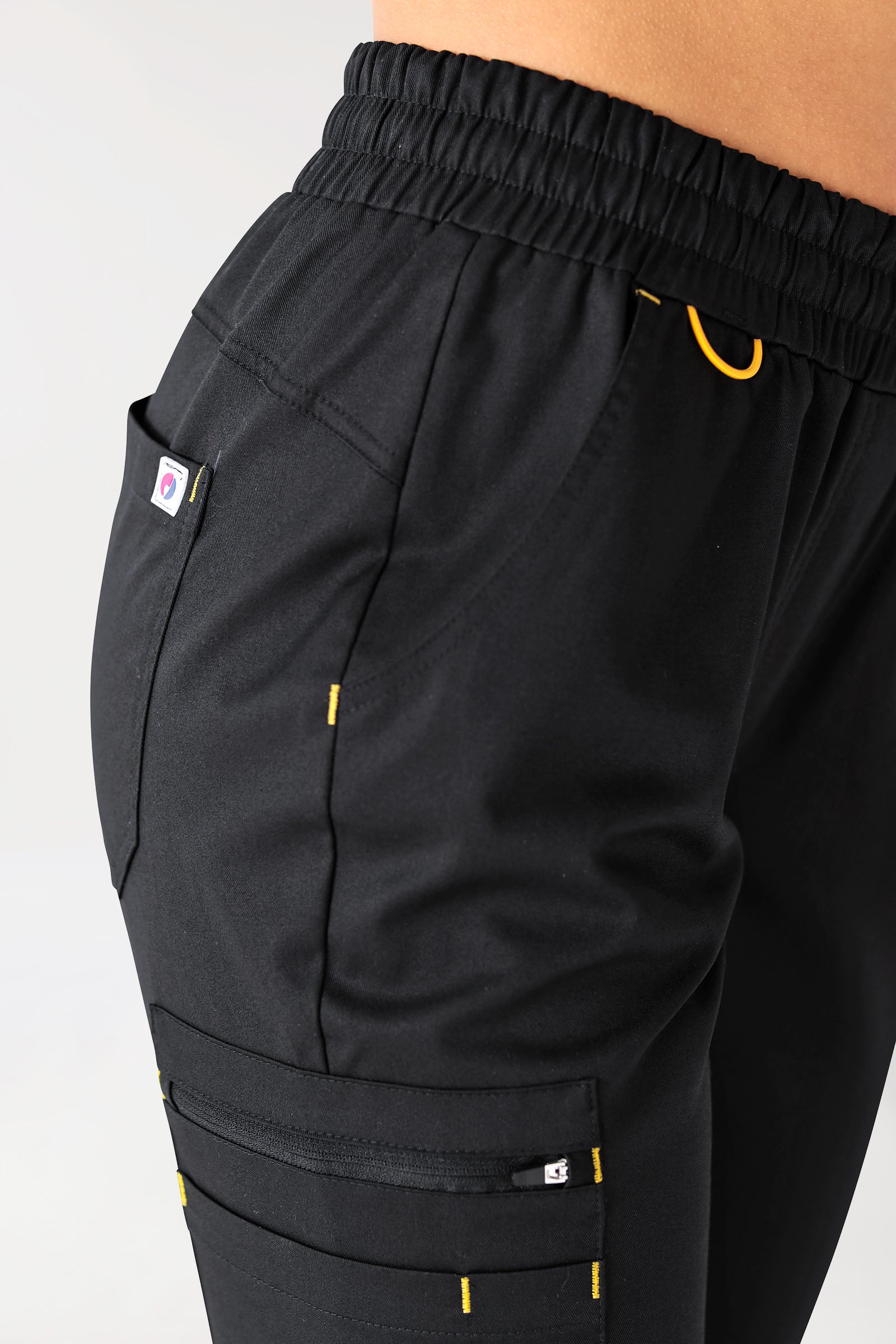 CLINIC STRETCH Pantalon Femme - Ceinture en maille noir/jaune